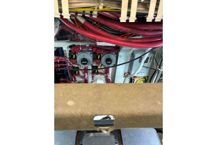 Engine room of 2004 Carver 466 Motor Yacht with visible wiring and components. Engine room of 2004 Carver 466 Motor Yacht with visible wiring and components.