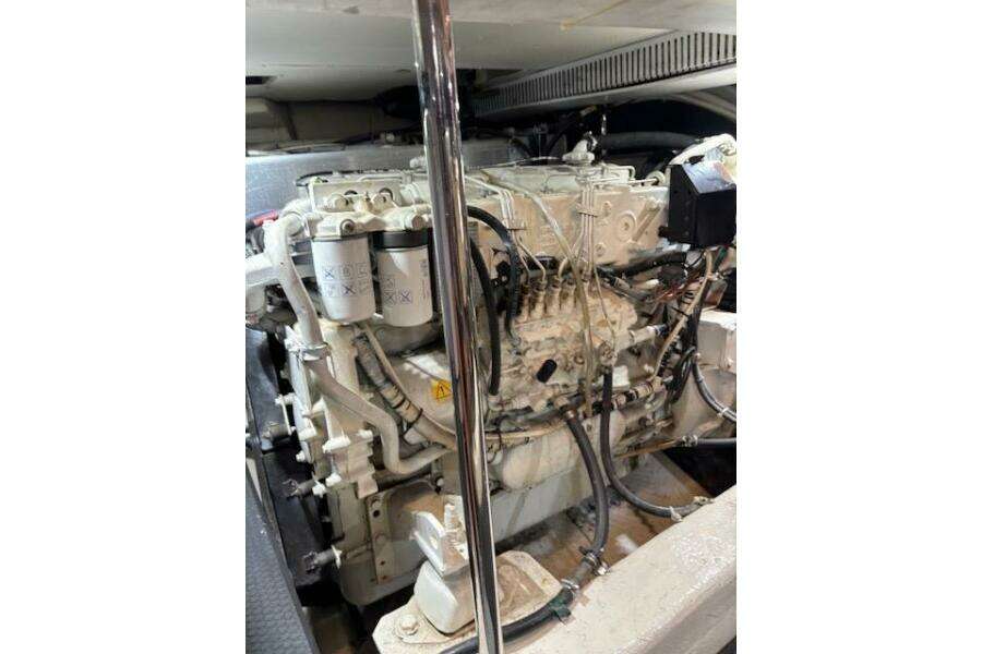 Engine room of 2004 Carver 466 Motor Yacht, showcasing detailed machinery components. Engine room of 2004 Carver 466 Motor Yacht, showcasing detailed machinery components.