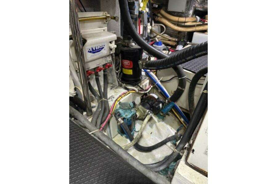 Engine room of 2004 Carver 466 Motor Yacht with various mechanical components. Engine room of 2004 Carver 466 Motor Yacht with various mechanical components.