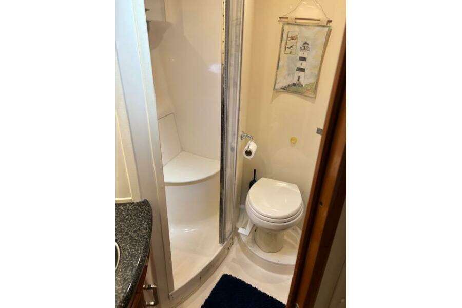 Bathroom interior of 2004 Carver 466 Motor Yacht with shower and toilet. Bathroom interior of 2004 Carver 466 Motor Yacht with shower and toilet.