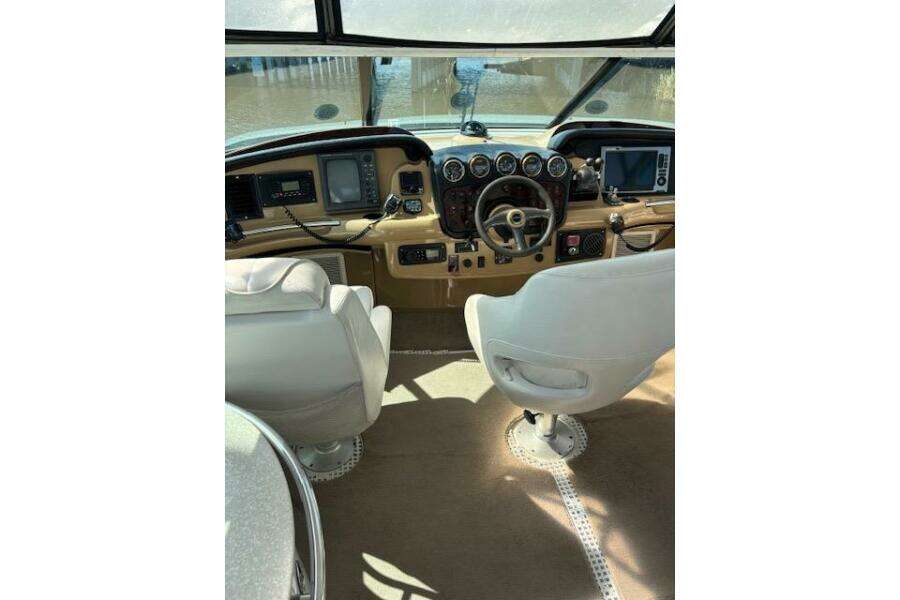 2004 Carver 466 Motor Yacht helm with dual seats and navigation instruments. 2004 Carver 466 Motor Yacht helm with dual seats and navigation instruments.