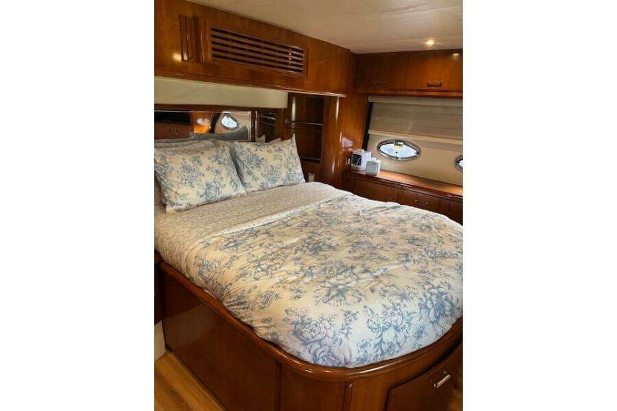 Luxurious bedroom interior of 2004 Carver 466 Motor Yacht with floral bedding. Luxurious bedroom interior of 2004 Carver 466 Motor Yacht with floral bedding.