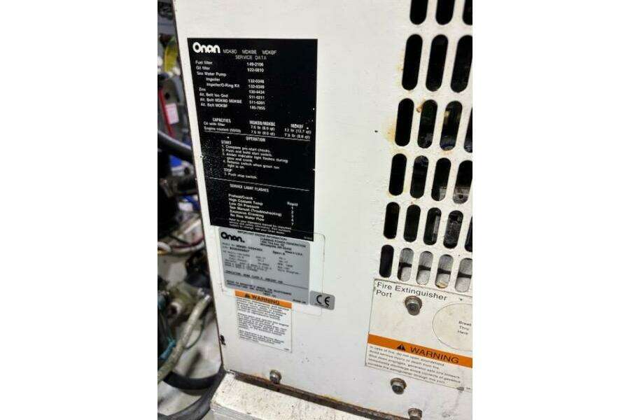 Onan generator panel on 2004 Carver 466 Motor Yacht, showing specifications and warnings. Onan generator panel on 2004 Carver 466 Motor Yacht, showing specifications and warnings.