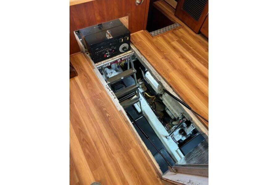Engine compartment of 2004 Carver 466 Motor Yacht with wooden flooring. Engine compartment of 2004 Carver 466 Motor Yacht with wooden flooring.