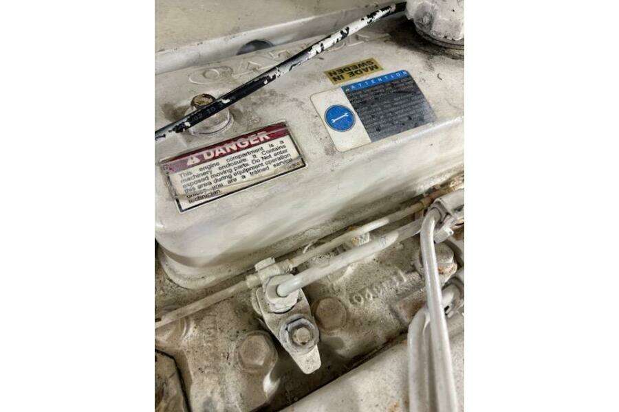 Engine compartment of 2004 Carver 466 Motor Yacht with warning labels. Engine compartment of 2004 Carver 466 Motor Yacht with warning labels.