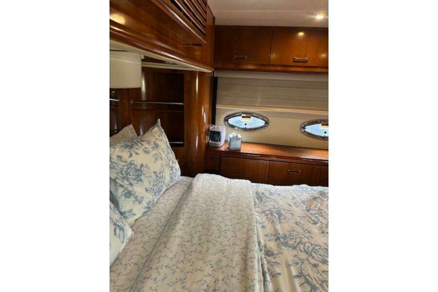Luxurious bedroom interior of 2004 Carver 466 Motor Yacht with elegant wood finish. Luxurious bedroom interior of 2004 Carver 466 Motor Yacht with elegant wood finish.
