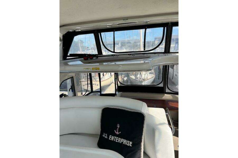 Interior of 2004 Carver 466 Motor Yacht with cushioned seating and large windows. Interior of 2004 Carver 466 Motor Yacht with cushioned seating and large windows.