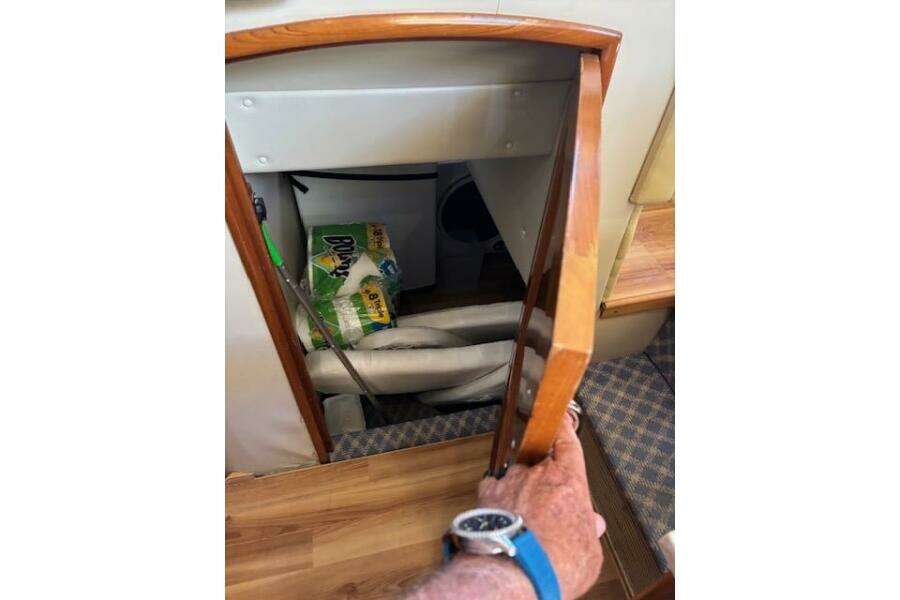 Storage compartment in 2004 Carver 466 Motor Yacht with cleaning supplies and equipment. Storage compartment in 2004 Carver 466 Motor Yacht with cleaning supplies and equipment.