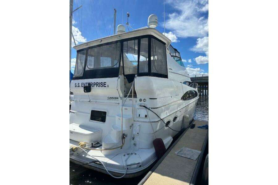 2004 Carver 466 Motor Yacht docked, rear view with clear skies. 2004 Carver 466 Motor Yacht docked, rear view with clear skies.