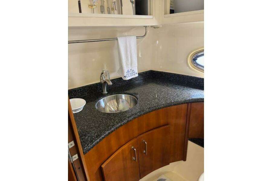 2004 Carver 466 Motor Yacht bathroom with granite countertop and sink. 2004 Carver 466 Motor Yacht bathroom with granite countertop and sink.