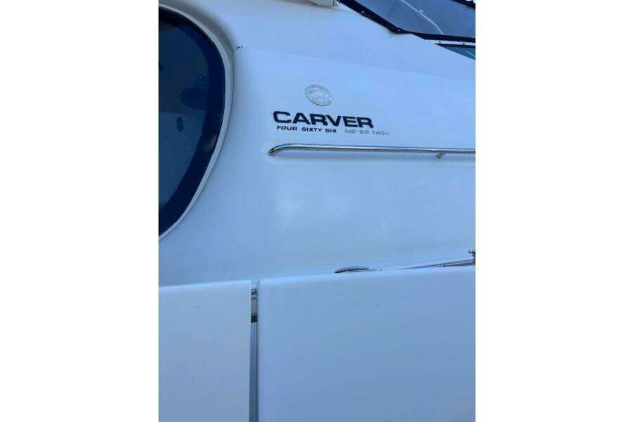 2004 Carver 466 Motor Yacht side view with logo detail. 2004 Carver 466 Motor Yacht side view with logo detail.