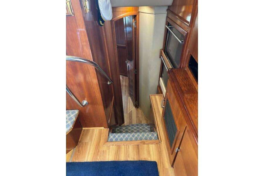 Interior of 2004 Carver 466 Motor Yacht with wooden stairs and cabinetry. Interior of 2004 Carver 466 Motor Yacht with wooden stairs and cabinetry.