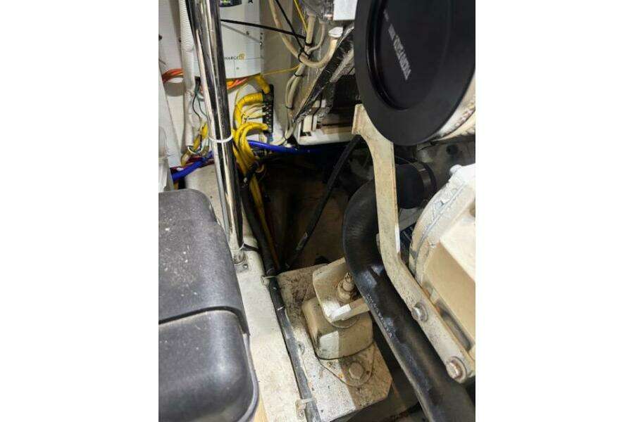 Engine room of a 2004 Carver 466 Motor Yacht, showing mechanical components and wiring. Engine room of a 2004 Carver 466 Motor Yacht, showing mechanical components and wiring.