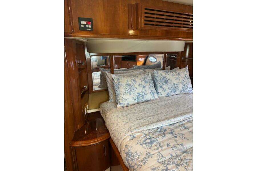 Luxurious bedroom interior of 2004 Carver 466 Motor Yacht with floral bedding. Luxurious bedroom interior of 2004 Carver 466 Motor Yacht with floral bedding.