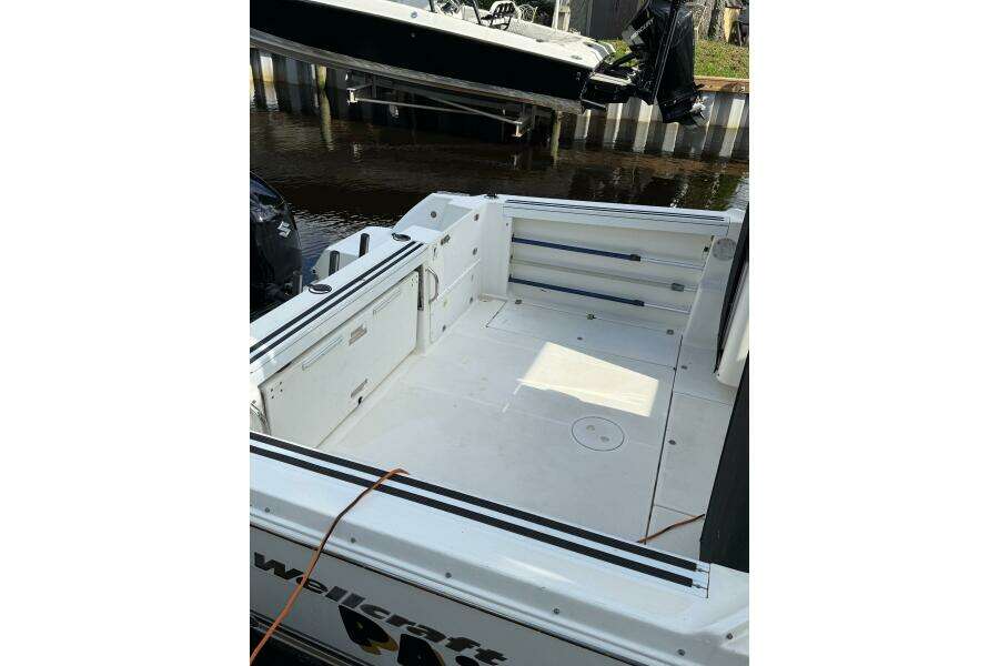 2002 Wellcraft 290 Coastal boat deck, spacious and clean, docked by the water. 2002 Wellcraft 290 Coastal boat deck, spacious and clean, docked by the water.