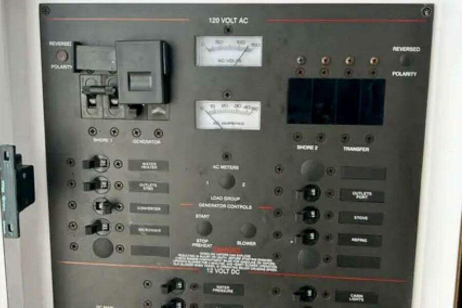 Electrical control panel on a 2002 Wellcraft 290 Coastal boat, featuring various switches and meters. Electrical control panel on a 2002 Wellcraft 290 Coastal boat, featuring various switches and meters.