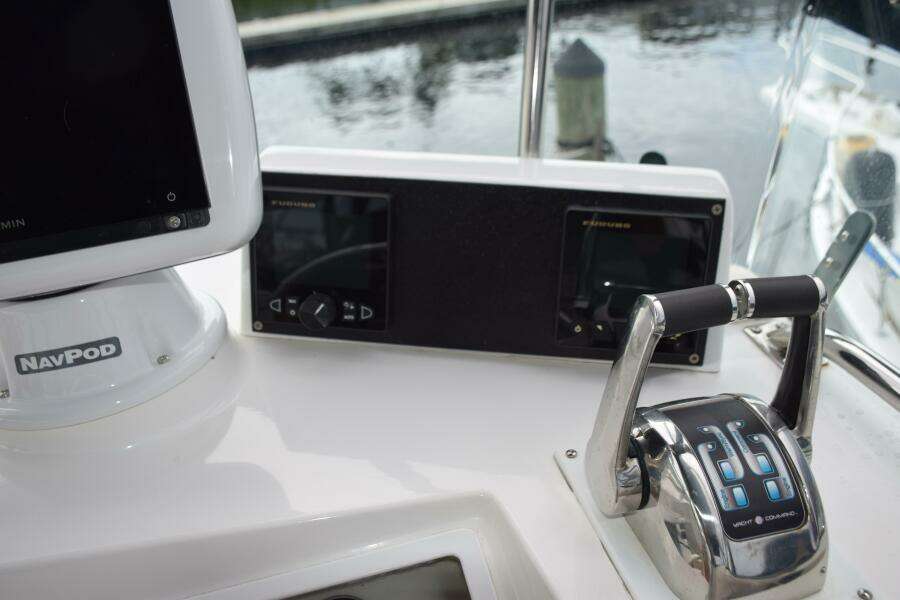 Control Panel Of A 1997 Grand Banks Classic Boat With Navigation Equipment.