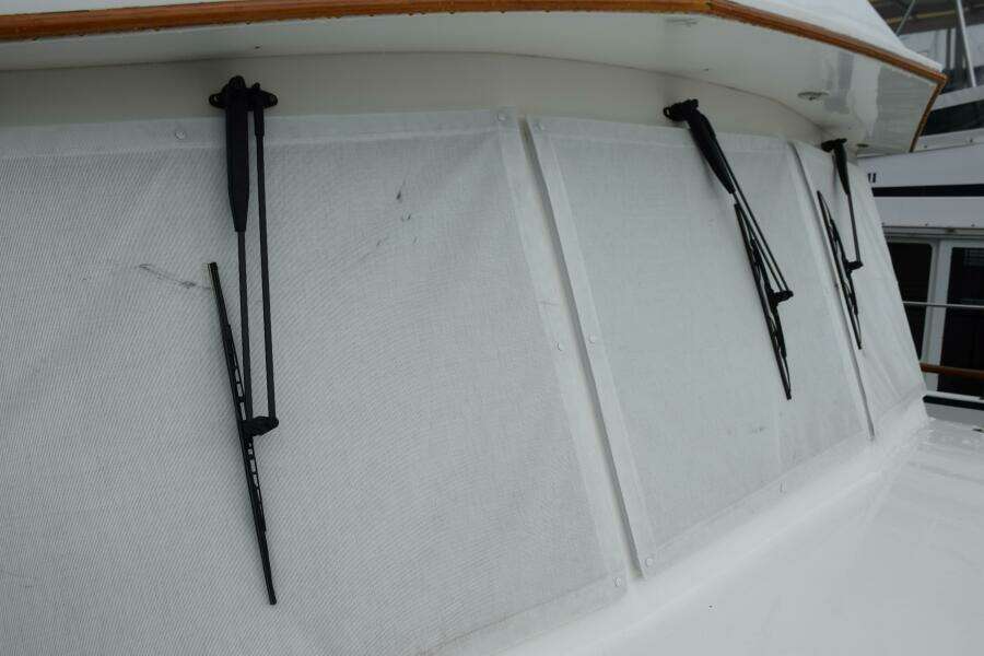 Windshield Wipers On A 1997 Grand Banks Classic Boat, Showcasing Its Exterior Design.