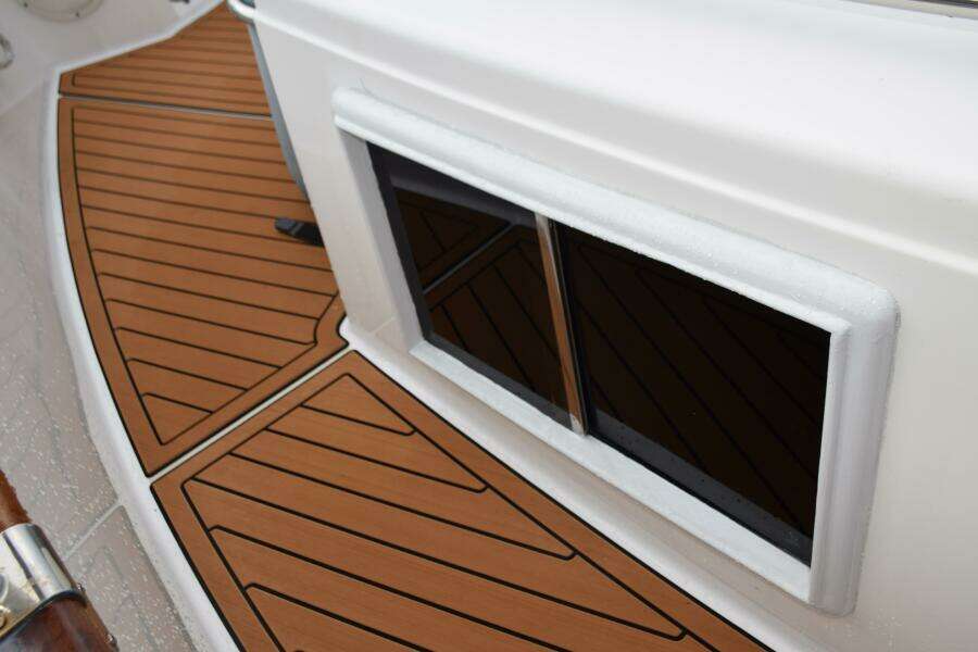 1997 Grand Banks Classic Boat Deck With Teak Flooring And Window Detail.