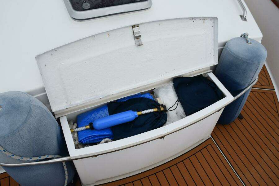 Open Storage Compartment On 1997 Grand Banks Classic Boat With Marine Equipment And Accessories.