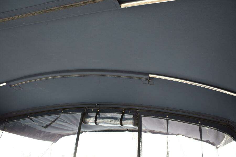 Interior View Of 1997 Grand Banks Classic Boat Canopy With Metal Support Bars.
