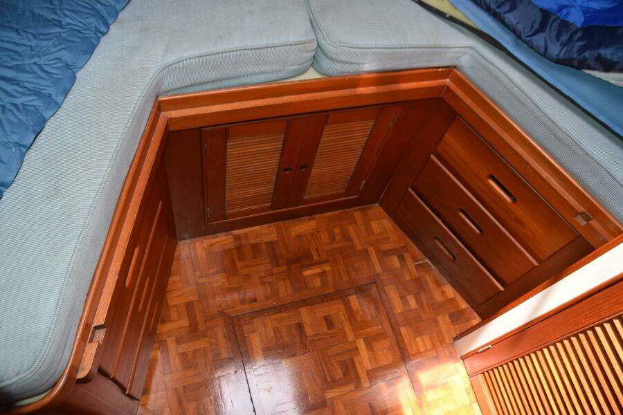 1997 Grand Banks Classic Interior With Wooden Cabinetry And Parquet Flooring.