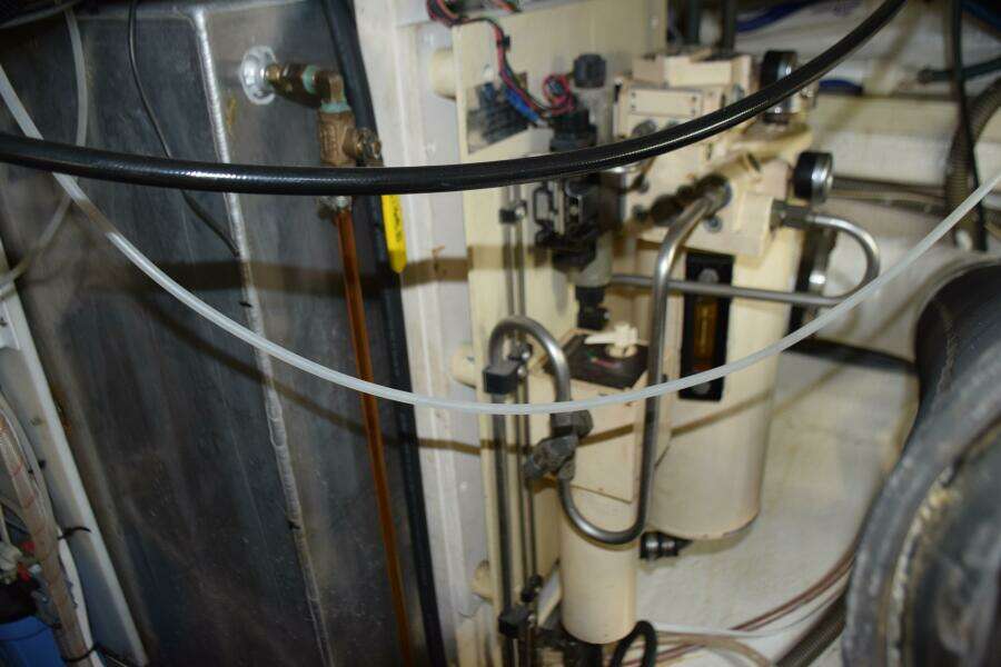 Engine Room Of A 1997 Grand Banks Classic Boat, Showcasing Mechanical Components And Wiring.