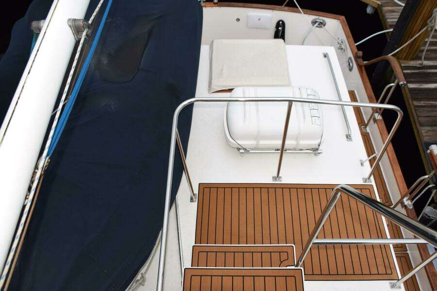 1997 Grand Banks Classic Yacht Deck With Wooden Flooring And Safety Railings.