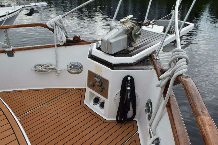 1997 Grand Banks Classic Boat Deck With Wooden Finish And Nautical Ropes.