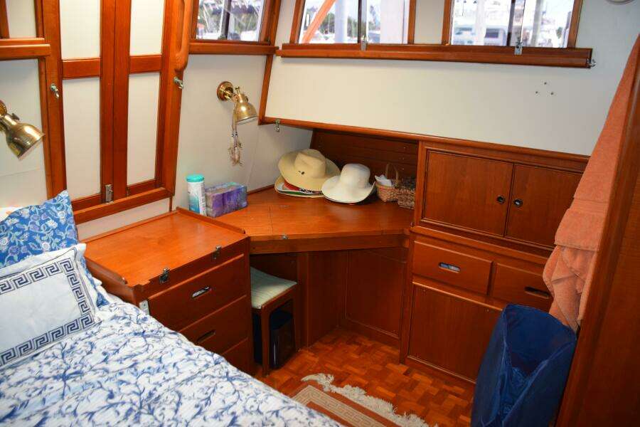 Cozy Cabin Interior Of 1997 Grand Banks Classic Yacht With Wooden Furnishings And Nautical Decor.