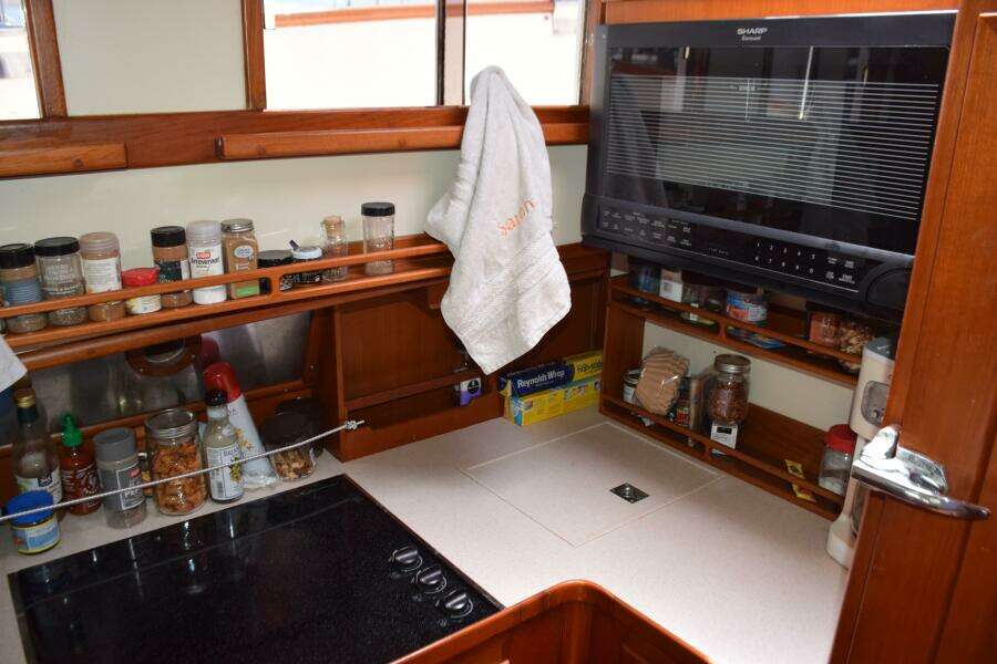 1997 Grand Banks Classic Yacht Kitchen With Spices, Microwave, And Countertop (1)