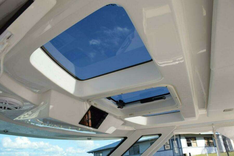 Opening Skylights Overhead Of Helm. Engine Data Screen In Overhead Panel
