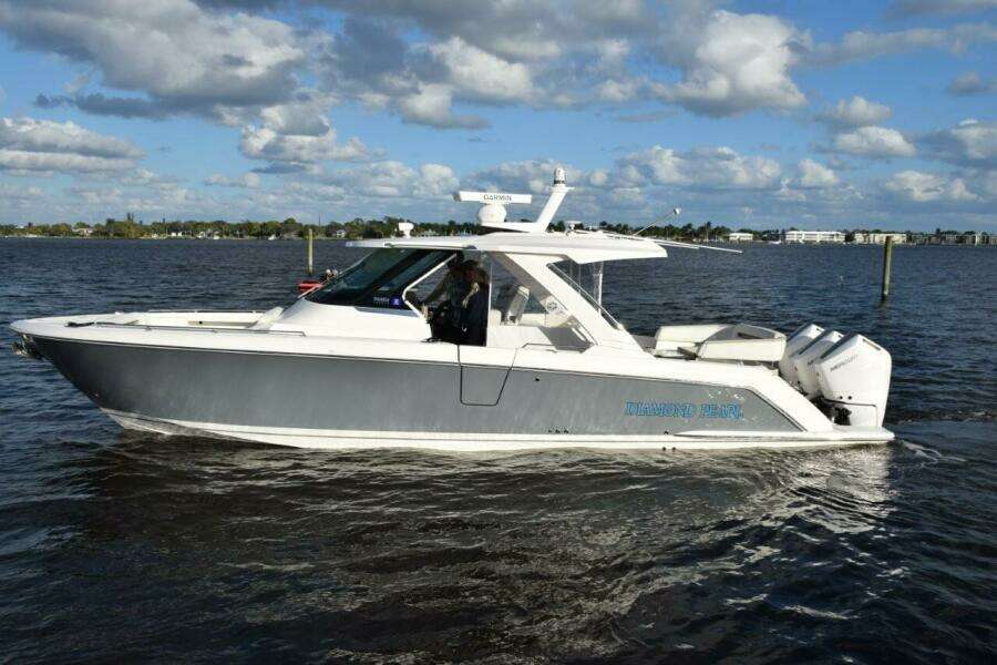 FLIR Camera Mounted On Top Of Mast And Easily Operated Through The Garmin Display. LED Remote Control Spotlight Forward On Hardtop