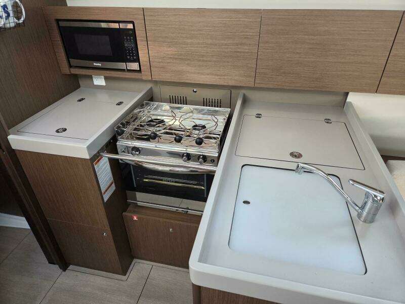 Galley with fridge/freezer, microwave, stove/oven, sink