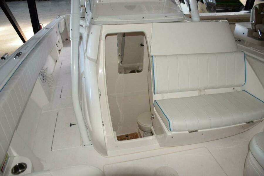 Console Electrically Slides Open To Head Compartment.