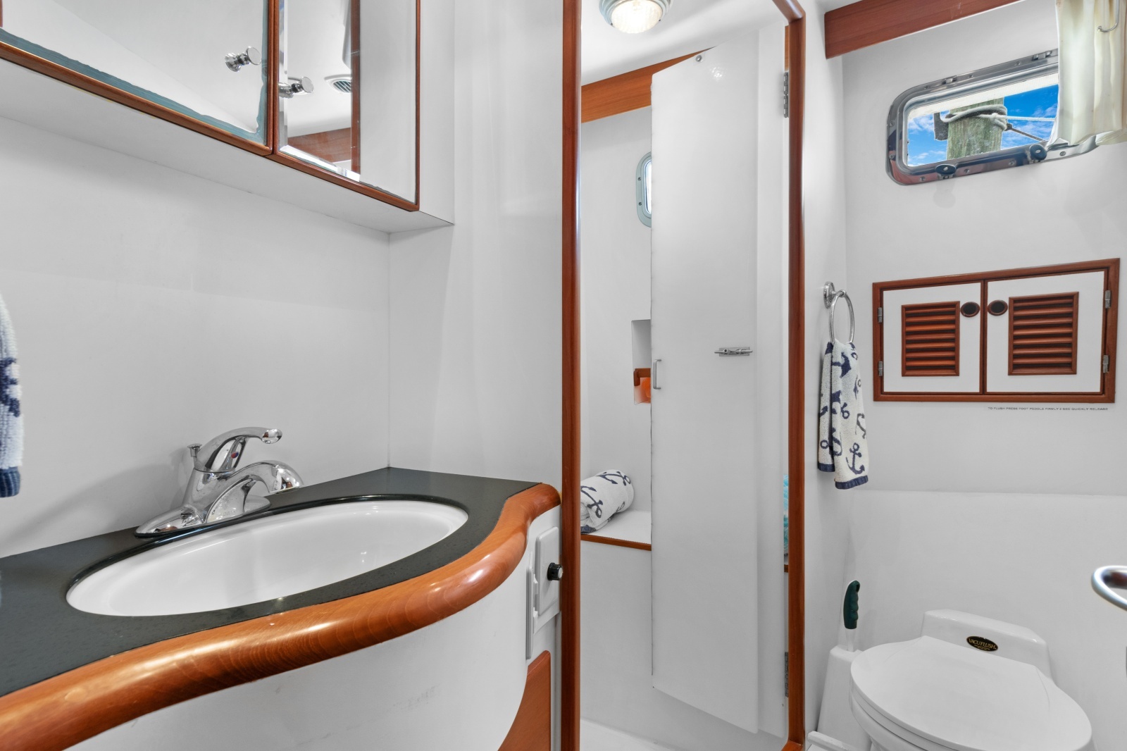 Guest Head With Shower Stall And Vacuflush Toilet