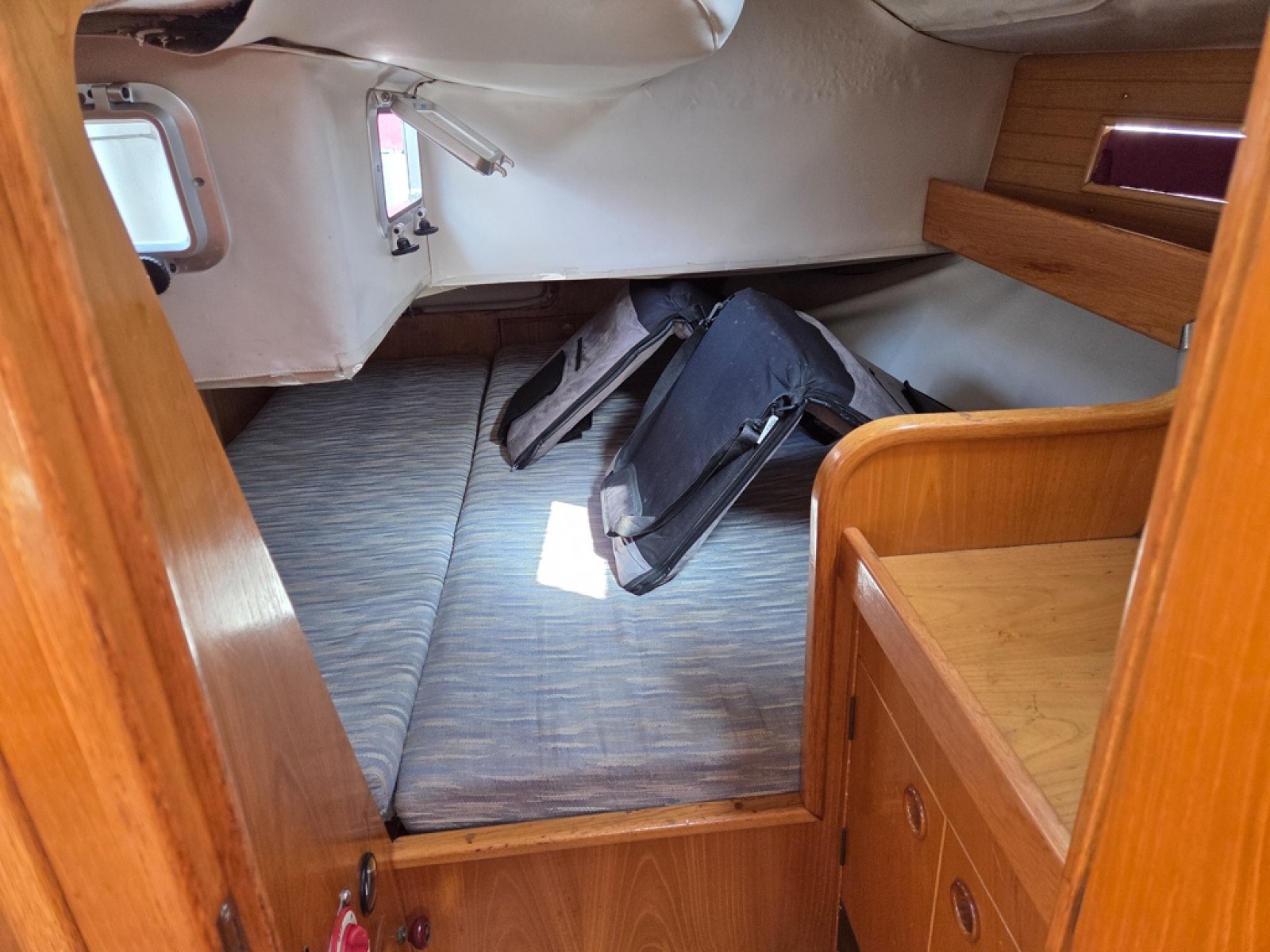 Beneteau Oceanis 350 spacious aft primary berth with storage and shelves