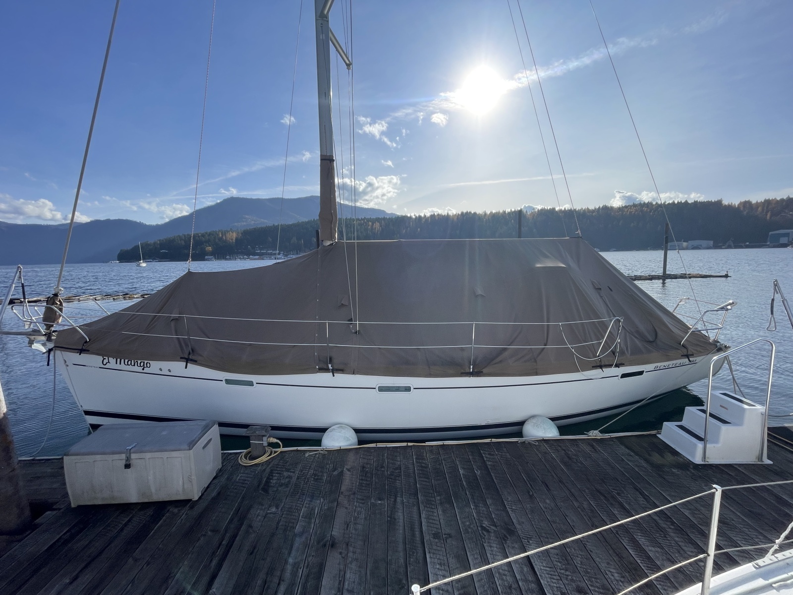 2007 Beneteau 393 sailboat docked with full cover