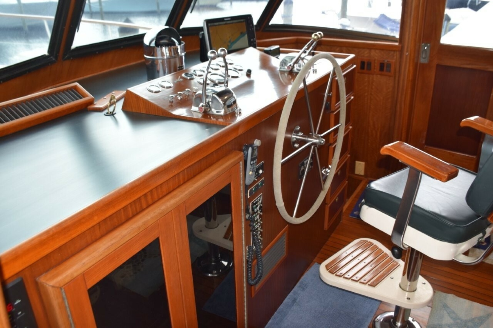 Pilothouse Has Wing Door And Full Helm Chair