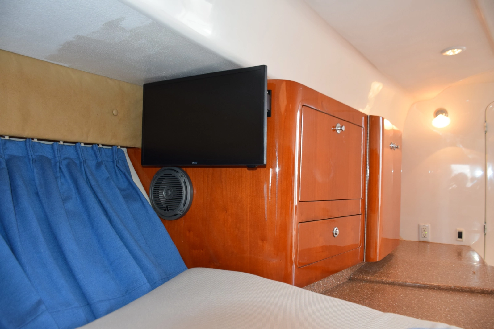 TV On Adjustable Wall Mount And Galley Countretop