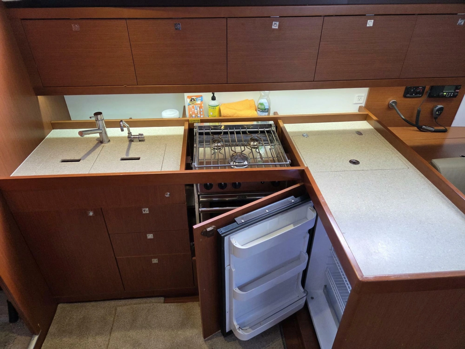 Galley with fridge, freezer, stove, oven, and double sink