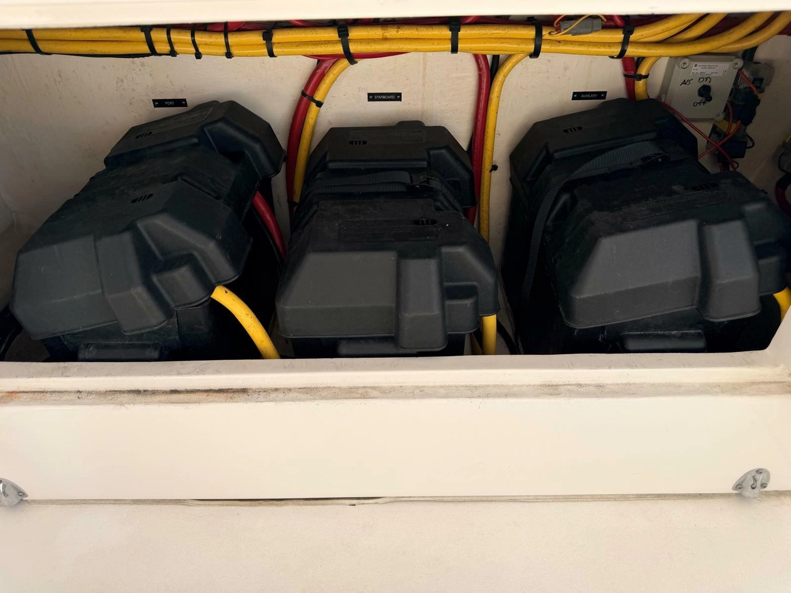 2017 Intrepid 327 Center Console for sale in Pompano Beach FL - battery compartment with three batteries and wiring