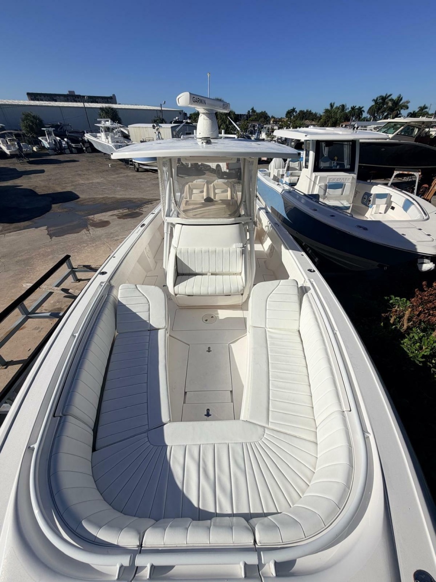 2017 Intrepid 327 Center Console for sale in Pompano Beach FL - bow-to-stern view of the cockpit and forward seating