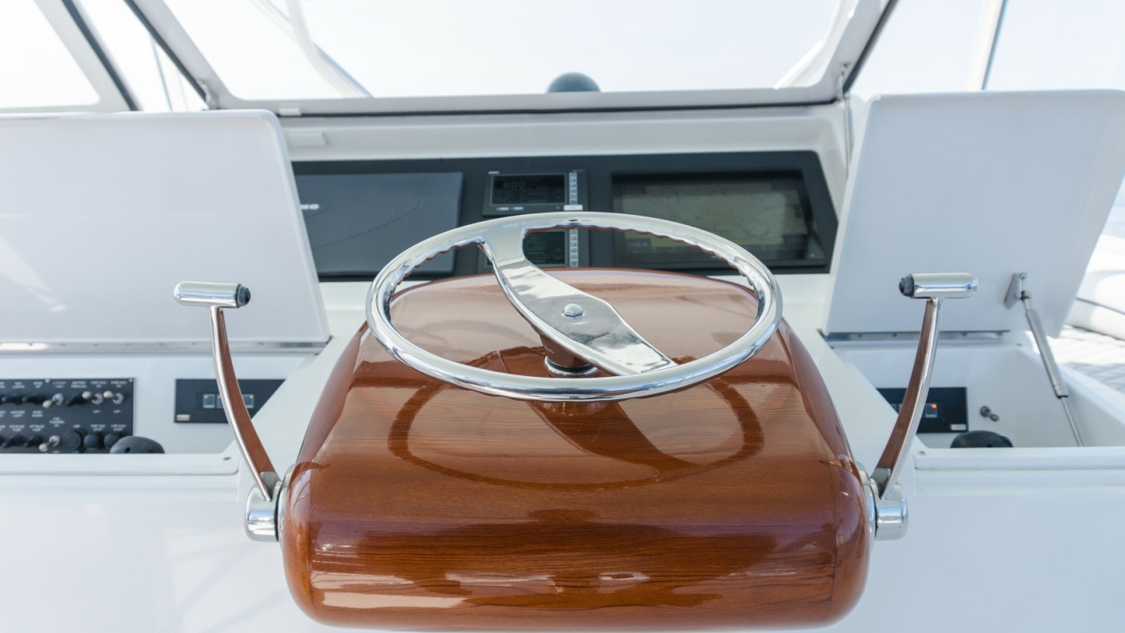 2009 Viking 50 Convertible "Jammin" - Featuring A Sleek, Polished Stainless Steel and Wooden Steering Wheel Station.