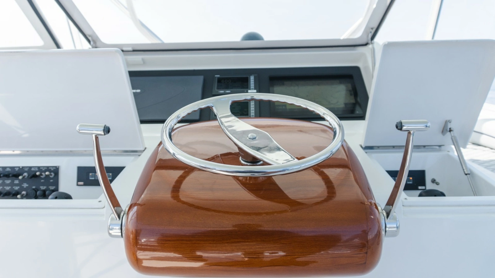 2009 Viking 50 Convertible "Jammin" - Featuring A Sleek, Polished Stainless Steel and Wooden Steering Wheel Station.
