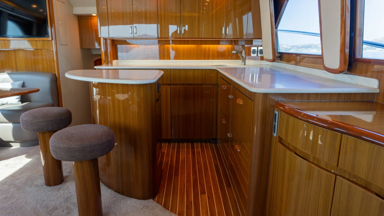 2009 Viking 50 Convertible "Jammin" - Galley with Polished Wood Finished Cabinets and Floor.