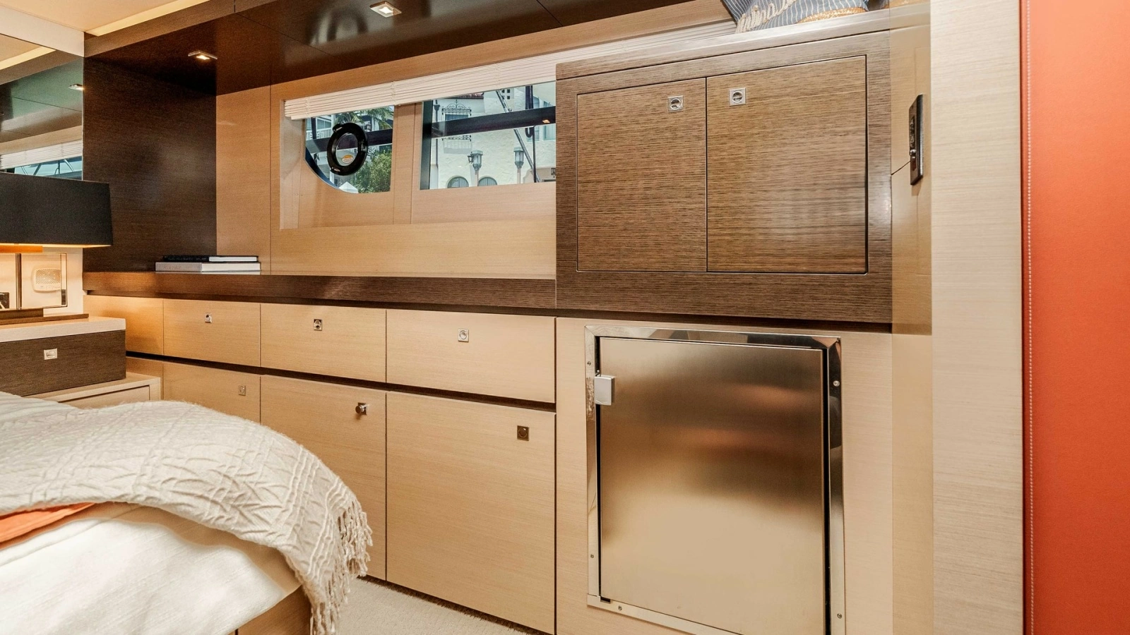 2017 Cruisers 60 Cantius 'Rising Star' - Master Stateroom Showcases Rich Wood Cabinetry & Stainless-Steel Mini-Fridge for a Stylish, Sophisticated Finish.