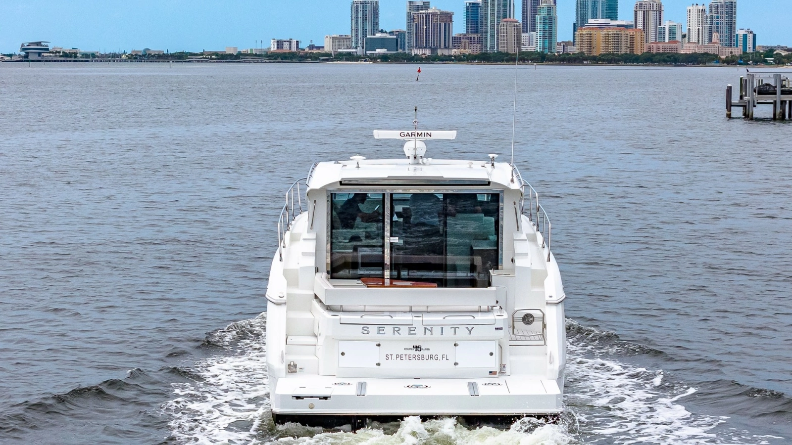 Aft View Cruising with Cityscape Backdrop