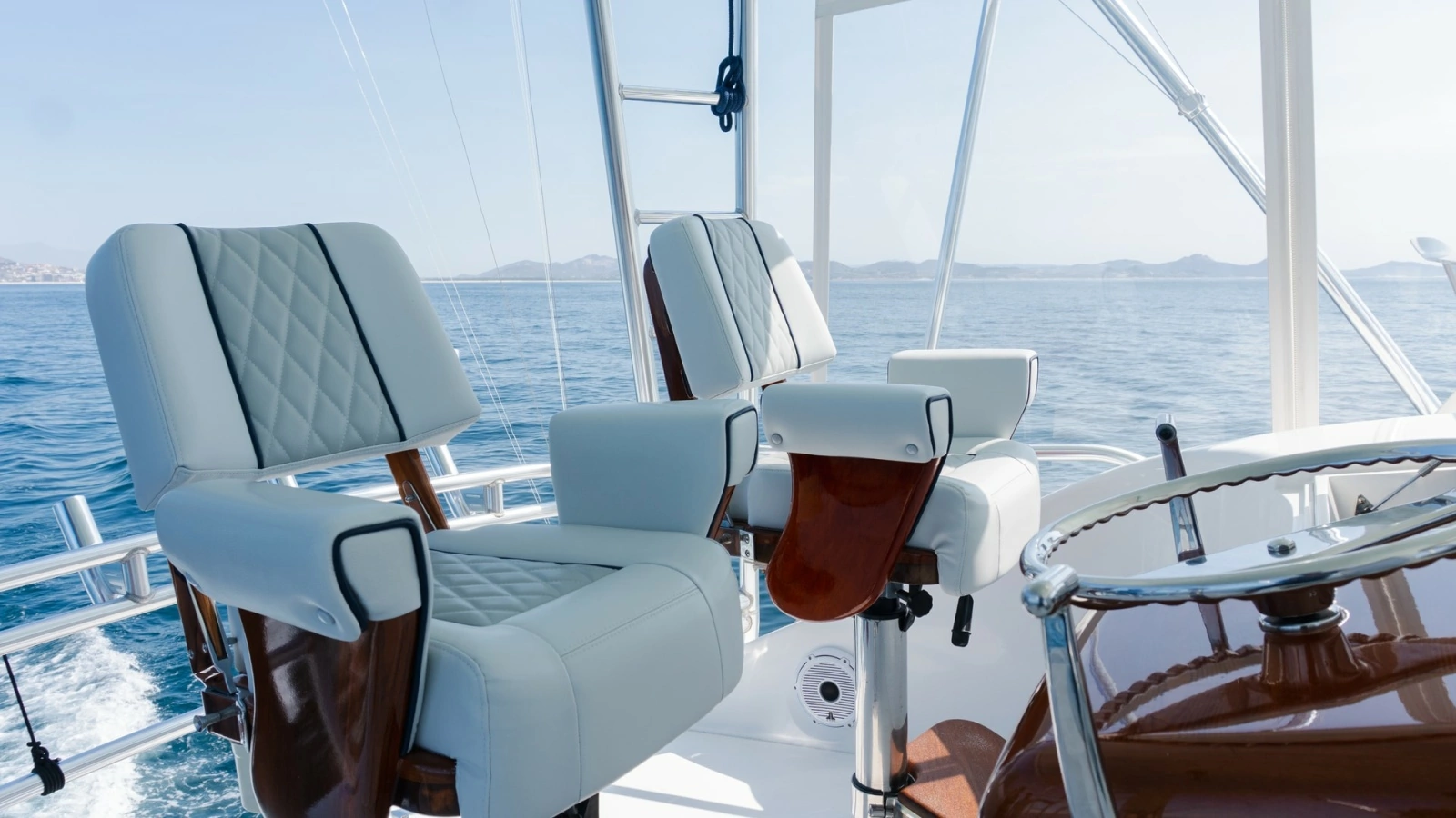 2009 Viking 50 Convertible "Jammin" - The Flybridge features Premium Captain's Chairs that Combine Comfort, Functionality, and Commanding Sightlines for an Elevated Boating Experience.