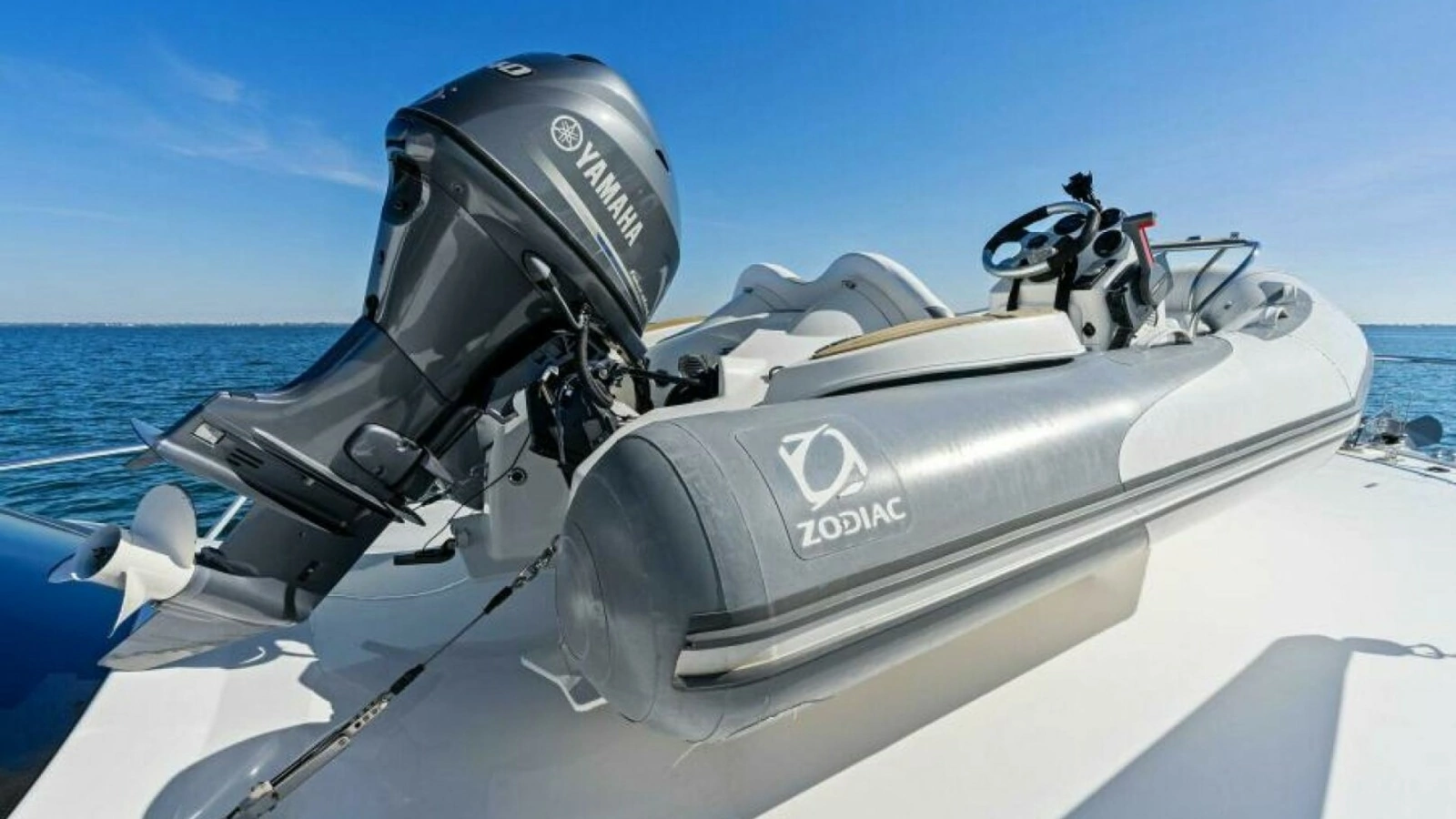 Tender on Bow with Outboard Motor